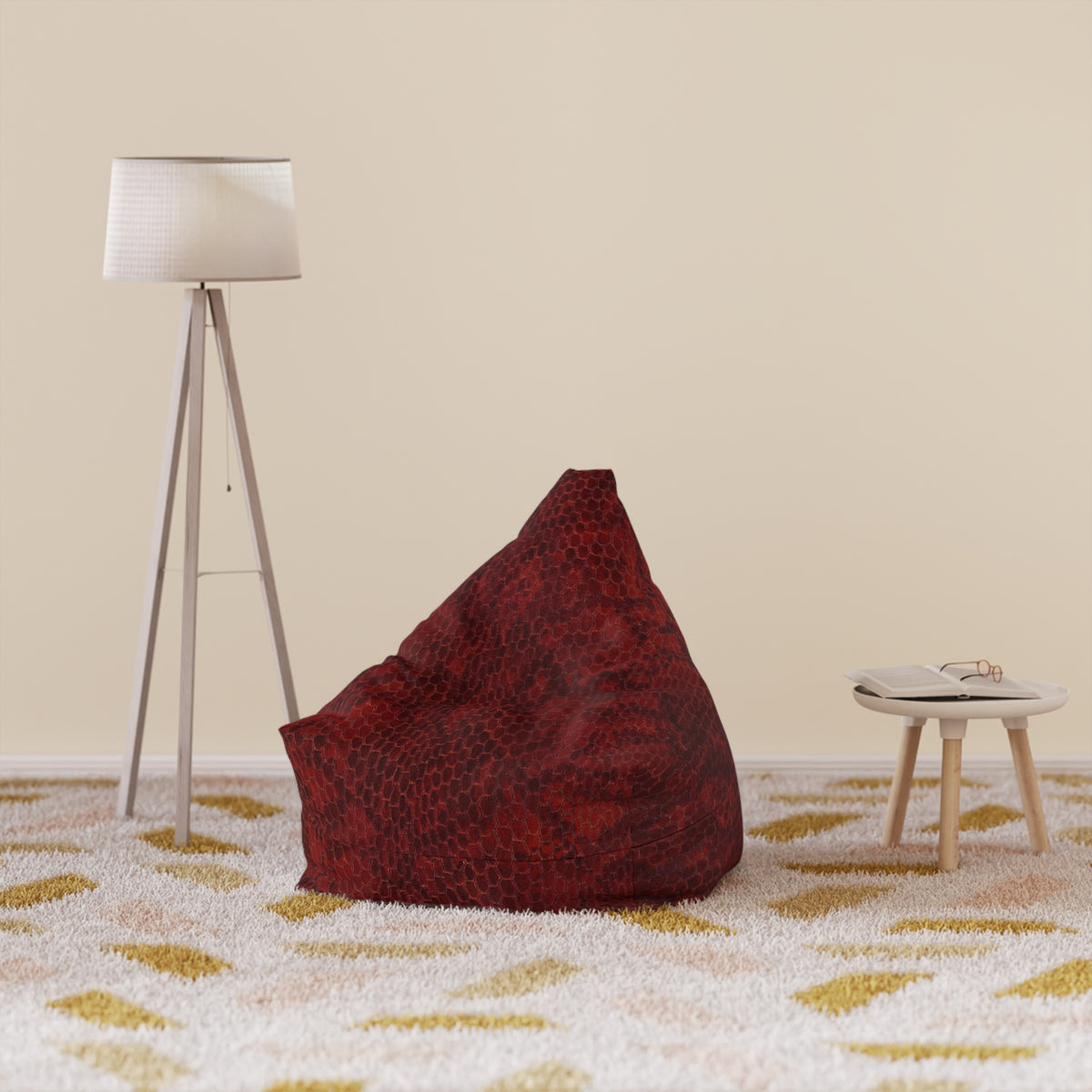 Red bean bag chair on a patterned carpet with a floor lamp and small table in the background.