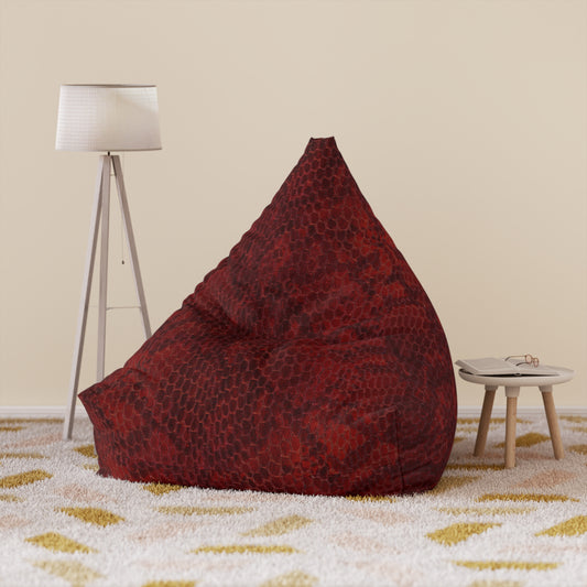 Red bean bag chair in a room with a lamp and small table.